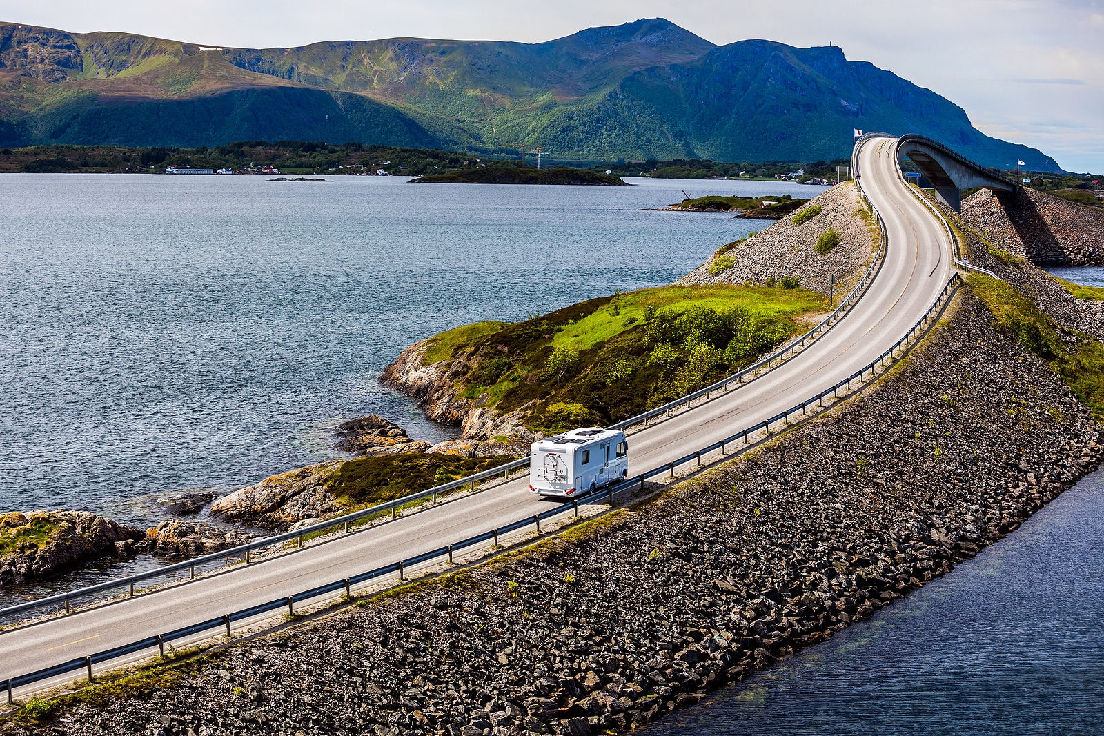 Caravan car RV travels on the highway Norway. Atlantic Ocean Roa